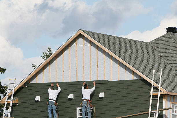 Professional Storm Damage Siding Repair technician working in Lowell, NC